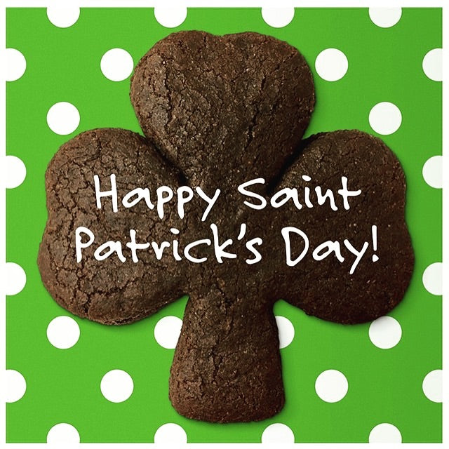 shamrock cookie over green and white dots